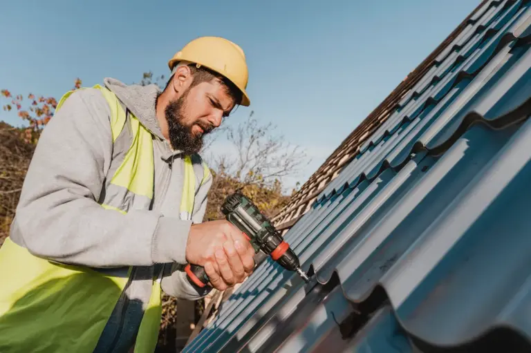 Roofing contractor repairing a residential roof in Miami